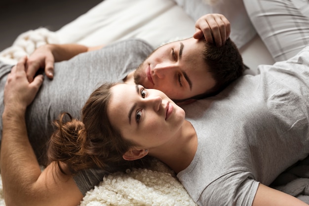 Free Photo | Close-up young couple next to each other in bed