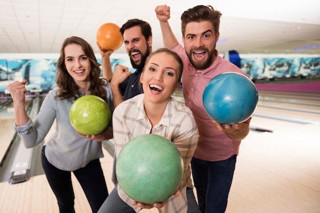 Free Photo | Close up on young friends enjoying bowling