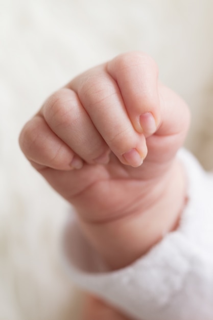 Premium Photo | Closeup Of Beautiful Cute Little Baby Hand. Maternity ...