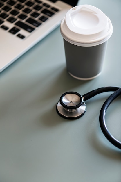 Free Photo | Closeup of doctor stethoscope with coffee paper cup