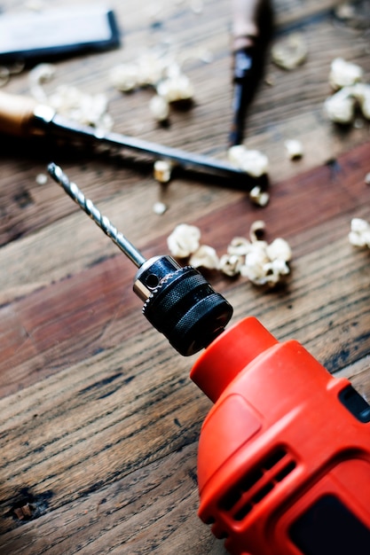 Free Photo | Closeup of drill on wooden table