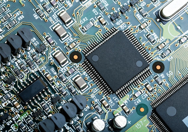 Closeup of electronic circuit board with cpu microchip electronic components background Free Photo