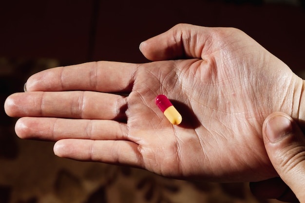 Premium Photo Closeup Of A Female Hand Holding A White Pill