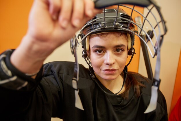 Premium Photo Closeup Of Female Hockey Player Opening Face Guard