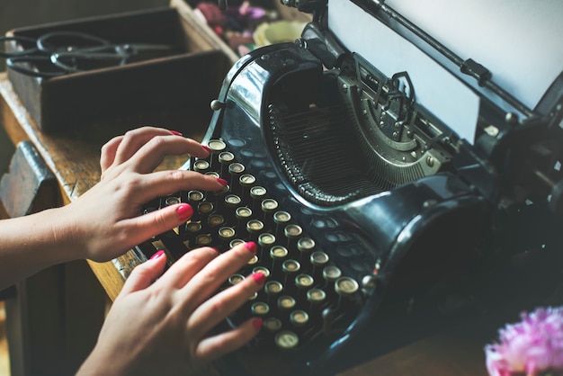 Premium Photo | Closeup of hands typing classic retro typewriter