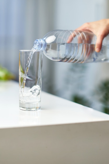 Premium Photo | Closeup image of a female hand holding drinking water ...