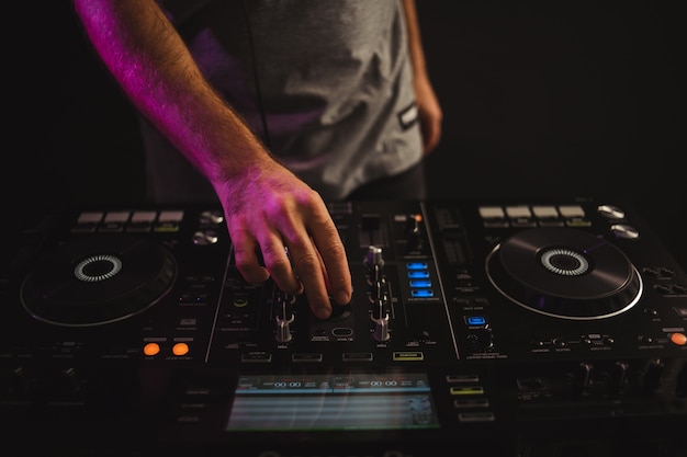 Free Photo | Closeup of a male dj working in studio