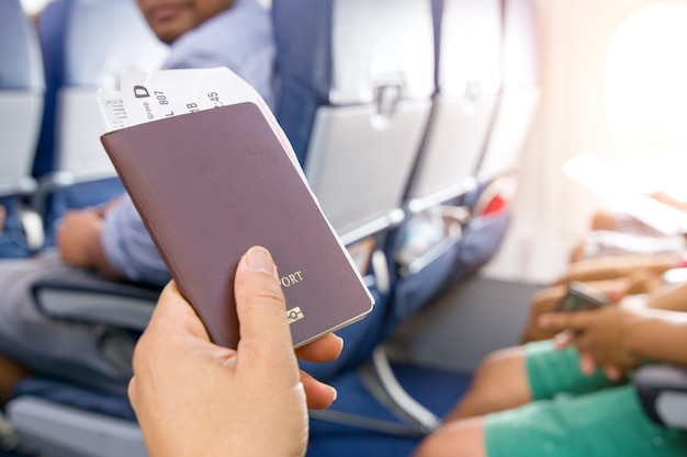 Premium Photo Closeup Of Man Holding Passports And Boarding Pass At