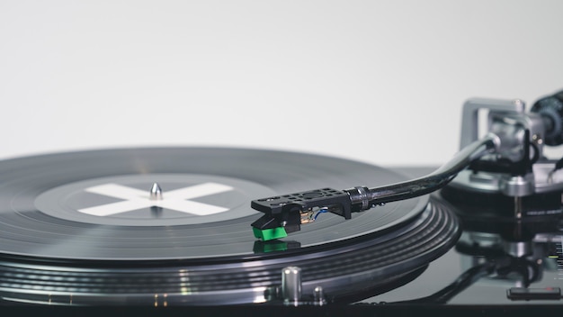 Premium Photo Closeup Of Modern Turntable Vinyl Record Player With Music Plate Needle On A Vinyl Record