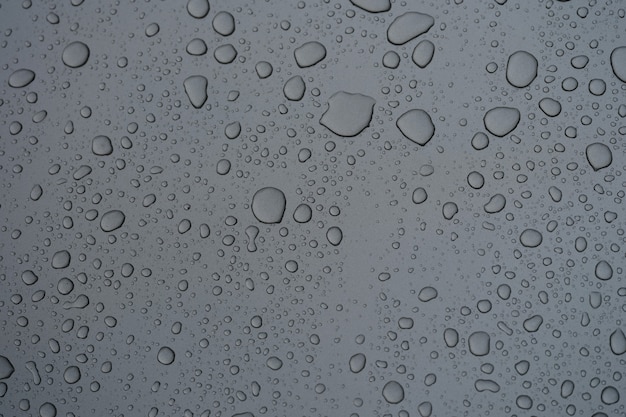 Premium Photo | Closeup of natural pattern of water drops on glass