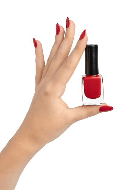 白に対して爪に長い赤いマニキュアと若い女性の手のクローズアップ プレミアム写真