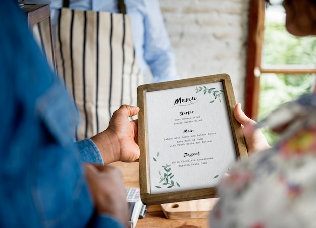 Premium Photo | Closeup of people hands holding menu list