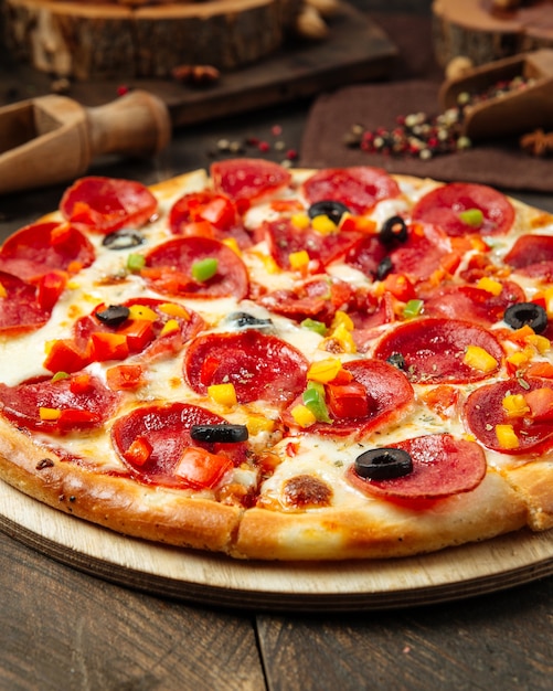 Premium Photo | Closeup on pepperoni pizza with bell pepper and salami