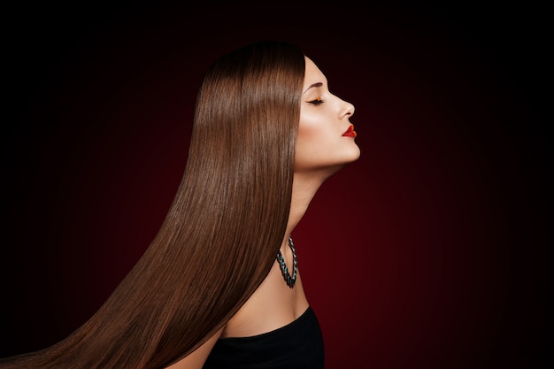 Closeup portrait of a beautiful young woman with elegant long shiny hair Premium Photo