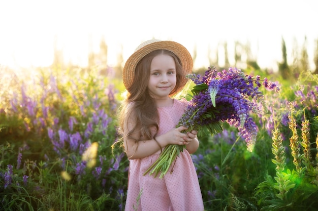 Premium Photo | Closeup portrait of smiling little girl with bouquet of ...