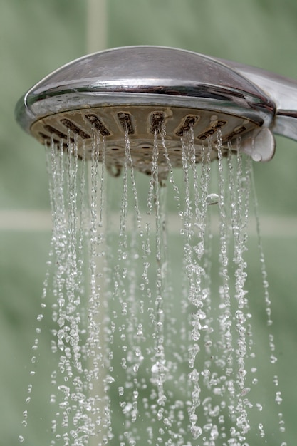 Premium Photo Closeup Of Shower Head With Flowing Water Splashing Out