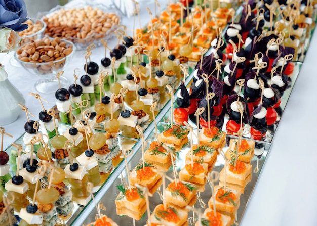 Premium Photo | Closeup of small canapes for catering arranged on a ...