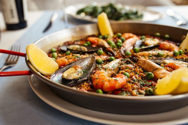 Premium Photo | Closeup on spanish national rice dish paella with