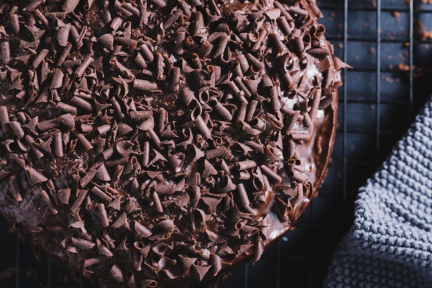 Premium Photo Closeup Of Tasty Chocolate Cake With Chocolate Chunks On Baking Sheet 