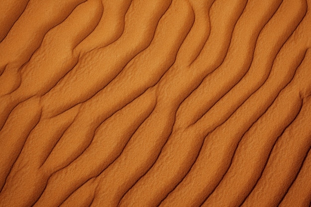 クローズアップ波状砂砂漠テクスチャ 上からの眺め プレミアム写真