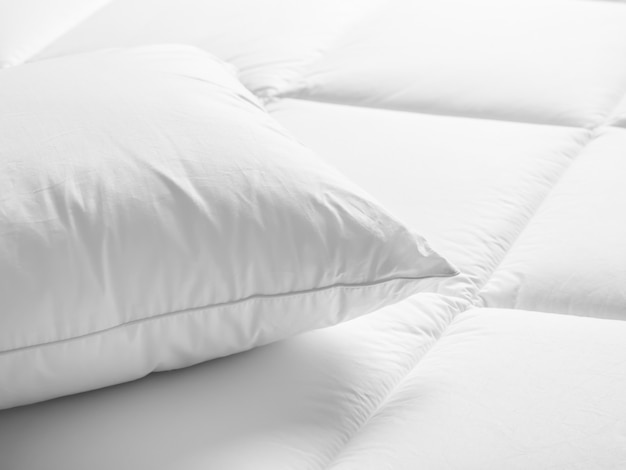 Premium Photo | Closeup of white pillow on the bed in the bedroom