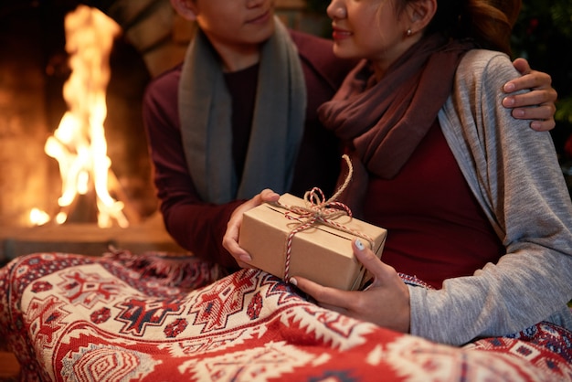 Free Photo Closeup Of Young Couple Cuddling At The Fireplace With A