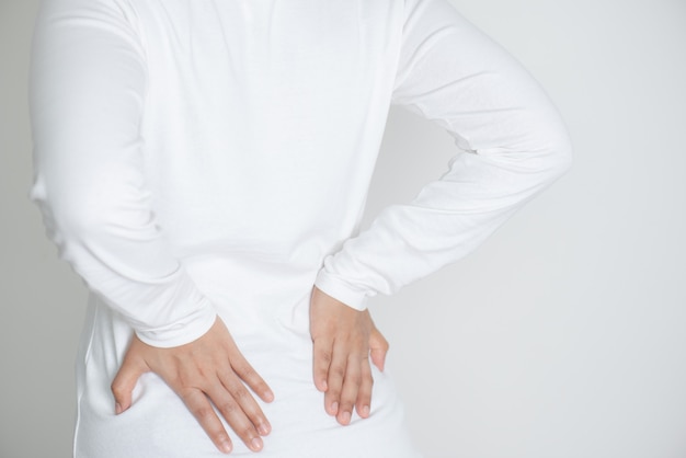 Premium Photo | Closeup of young woman suffering from back pain