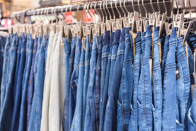 Premium Photo | Clothes on clothes rail in clothing store