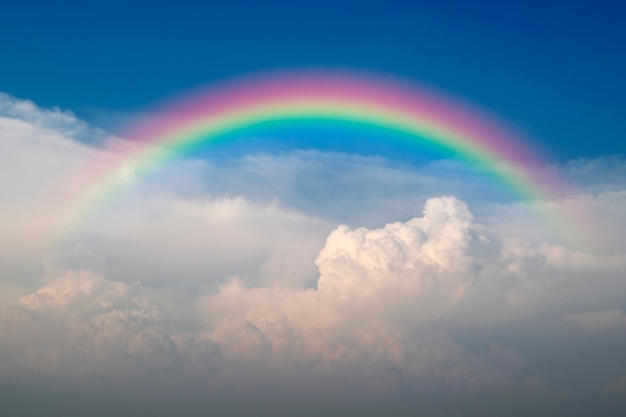 Download Cloudscape with blue sky and white clouds rainbow Photo ...