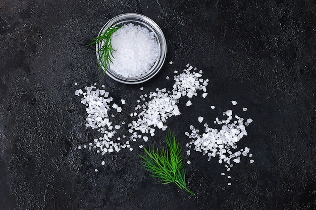 Premium Photo Coarse Salt Crystals On A Black Table