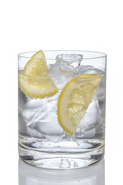 Premium Photo | Cocktail gin and tonic with lemon and ice isolated on ...