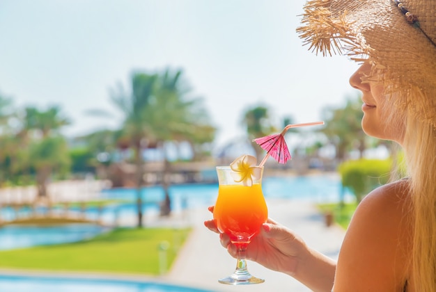 Premium Photo | Cocktail in the hands of a woman.