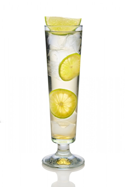 Cocktail with sparkling wine, lime and lemon in sling glass isolated on white Premium Photo