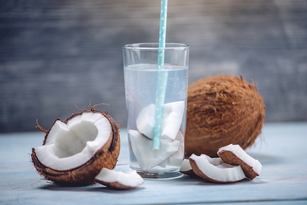 Premium Photo | Coconut water in the composition with an open coconut