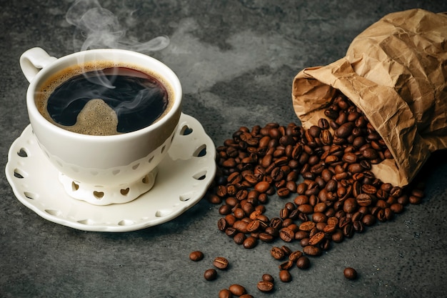 Premium Photo | Coffee background. coffee beans and cup on dark ...