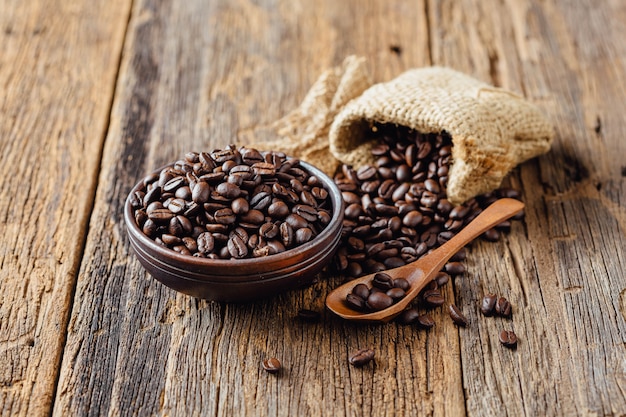 Premium Photo | Coffee beans on old wood