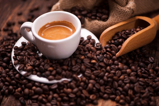 Premium Photo | Coffee on the coffee beans background