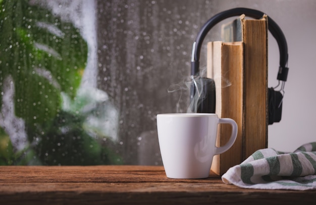 Premium Photo Coffee Cup On A Rainy Day Window