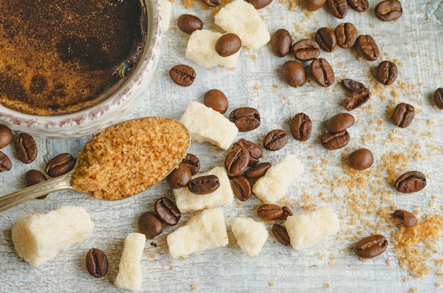 Coffee In A Small Cup With Cane Brown Sugar And Lump Sugar On Gray