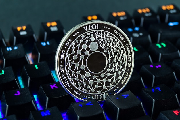 Premium Photo | Coin cryptocurrency iota close - up of the colour ...