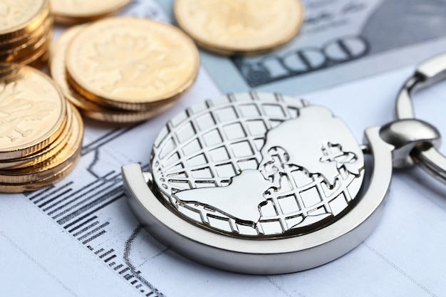 Coins, paper money and globe on white Statistic form background Free Photo