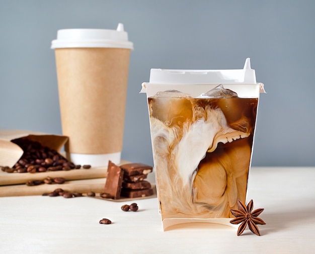 Premium Photo Cold Coffee And Milk In A Glass Cut In Half