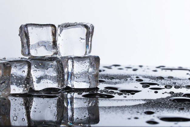 Premium Photo | Cold ice block wet fresh water on table