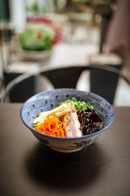 Premium Photo | Cold japanese hiyashi chuka ramen on wooden table