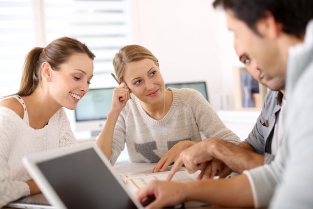 College people studying together in school lounge Photo | Premium Download