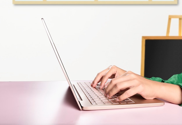 Premium Photo | College students typing on a laptop in the classroom ...