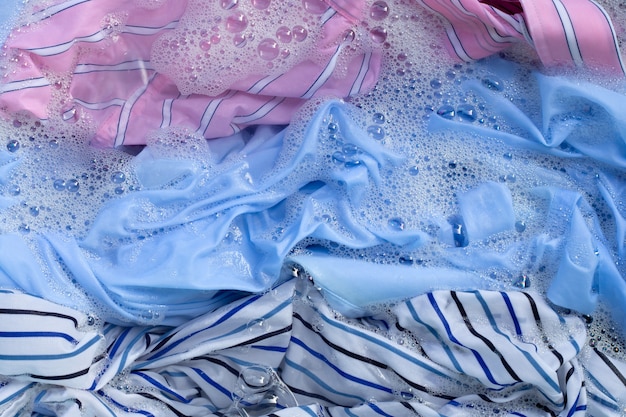 Premium Photo | Color clothes soak in powder detergent water dissolution.