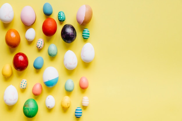 Free Photo | Colored eggs on yellow