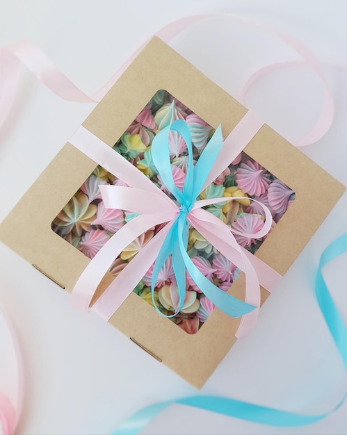 Premium Photo | Colored meringues in a gift box.