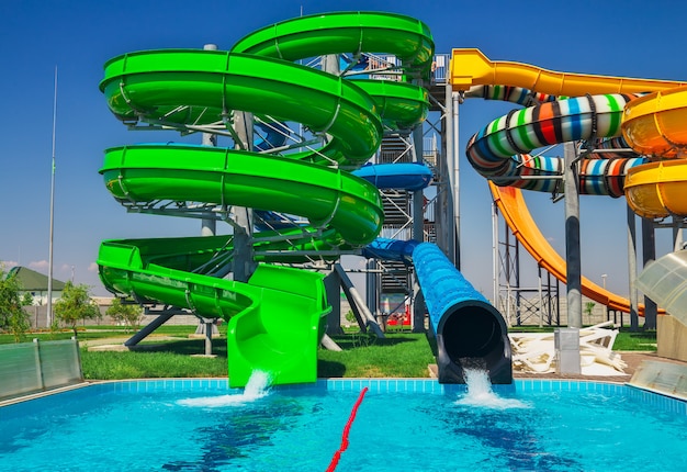 Premium Photo | Colorful aquapark slide with pool for everyone